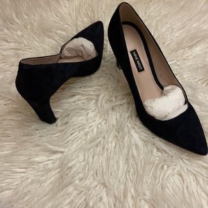 Cowhide Navy color, Suede heels, leather lining. Never Wore it, just new. No Box